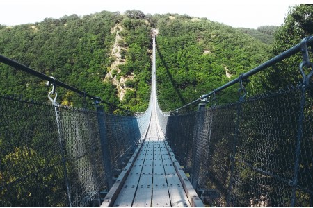 Suspension footbridge over ravine Suspension footbridge over ravine
